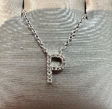 10k gold diamond initial pendant with adjustable chain.