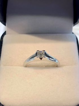 White Gold 1/4 carat diamond princess cut ring.