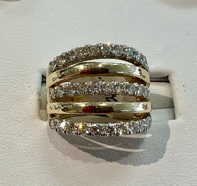 10K yellow and white gold; diamond band.
33 fancy cut diamonds: 1.50 carat total weight
Canadian Certified Gold