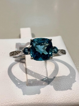 10k white gold london blue topaz ring.