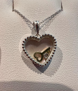 10k white gold diamond heart pendant with gold key and pink mother of pearl.