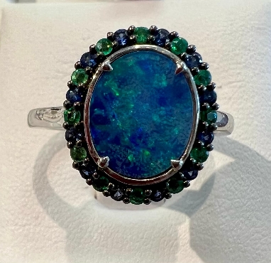 10k white gold blue opal ring with sapphire and emerald halo.