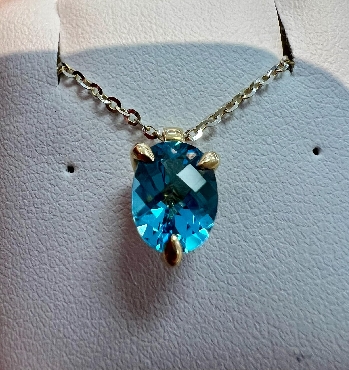 14kt yellow gold blue topaz pendant.